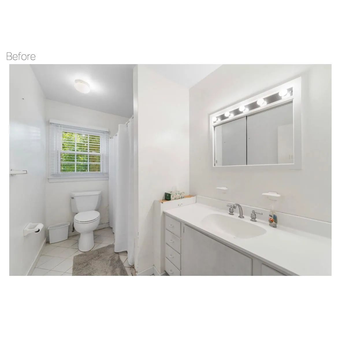 White bathroom with a sink, mirror, toilet, shower curtain, and window.