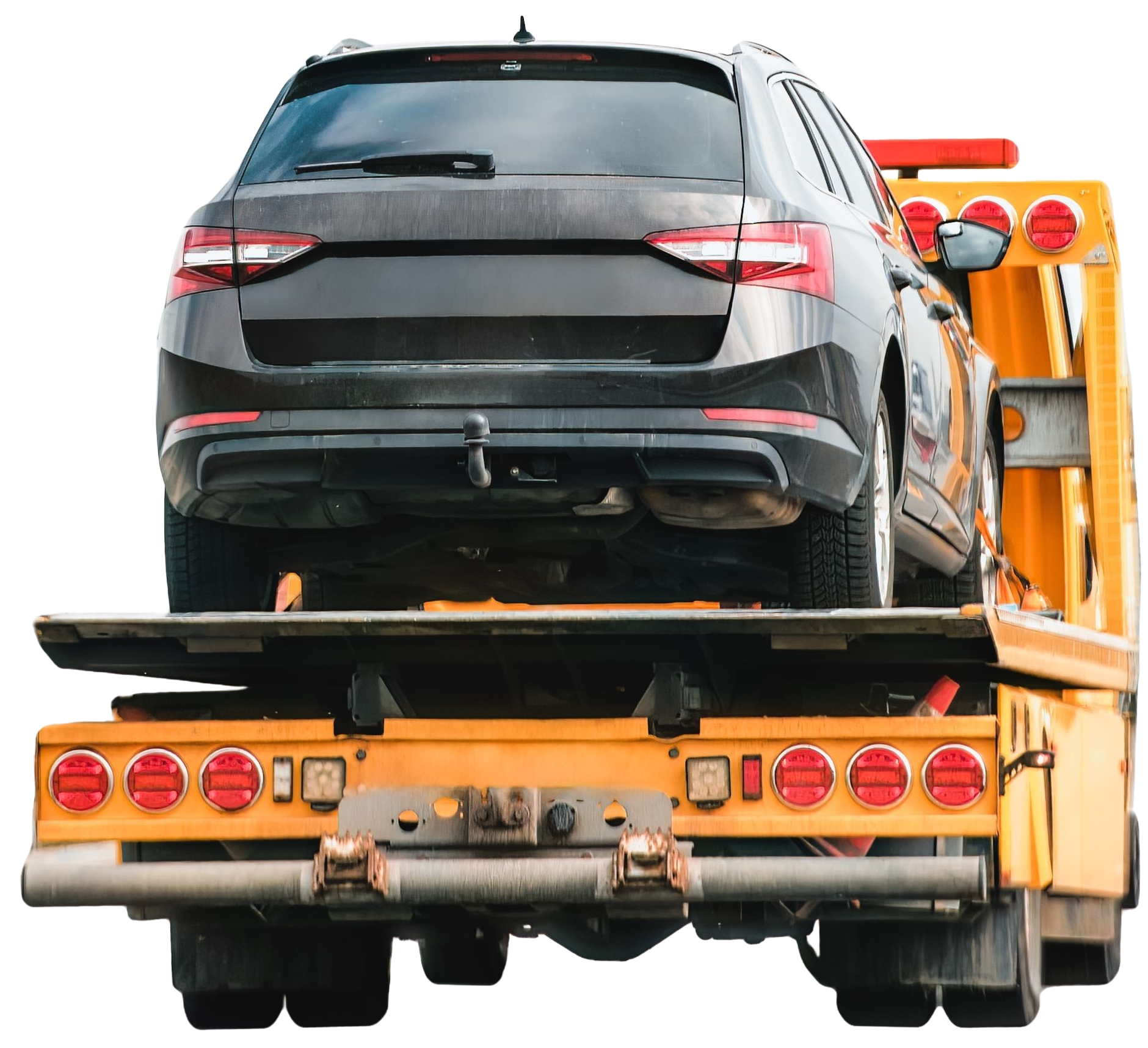 Black car loaded onto a yellow tow truck.