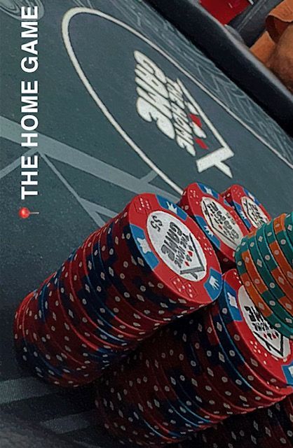 A man and a woman are playing poker in a casino.