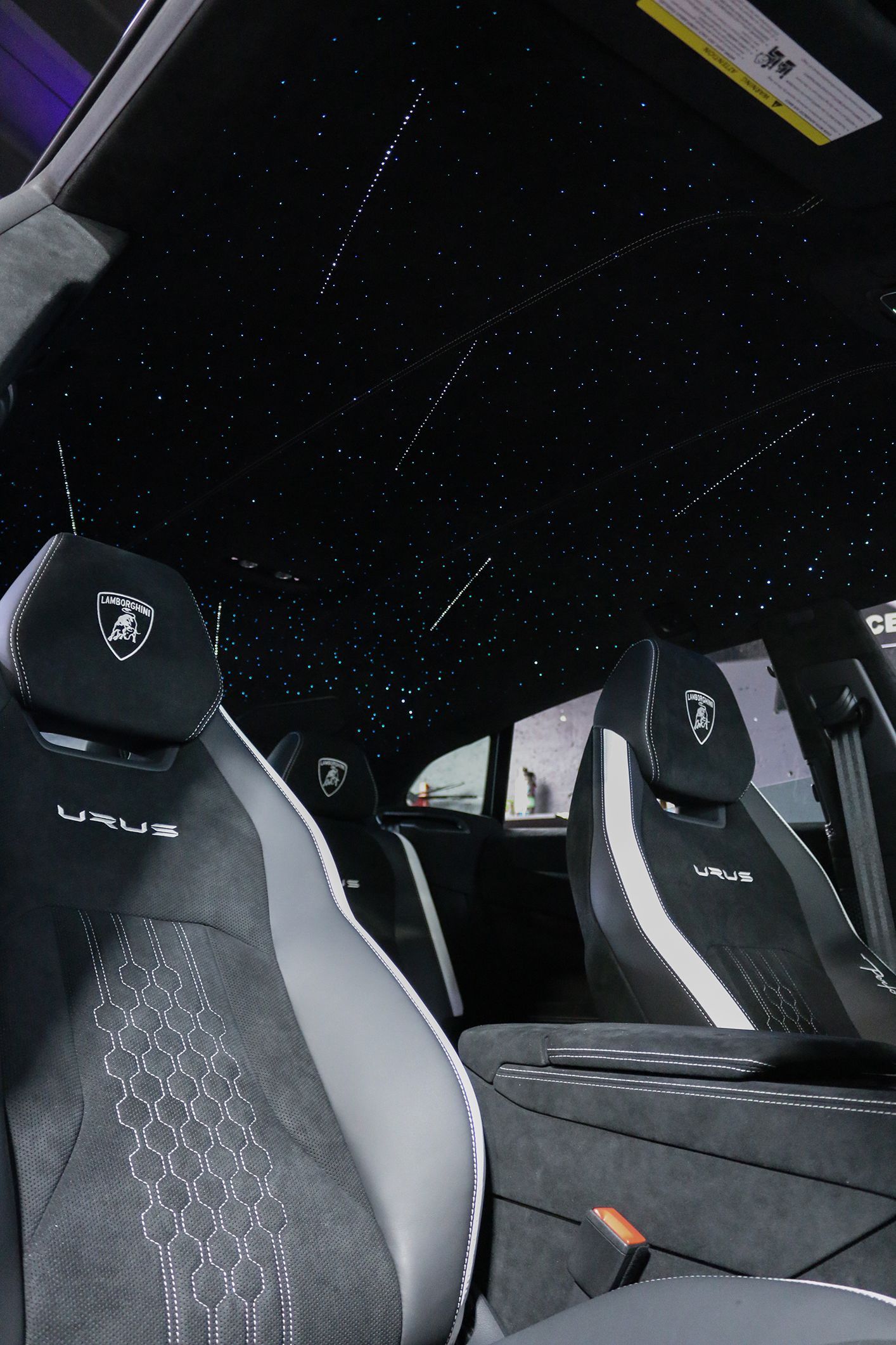 The inside of a car with a starry ceiling