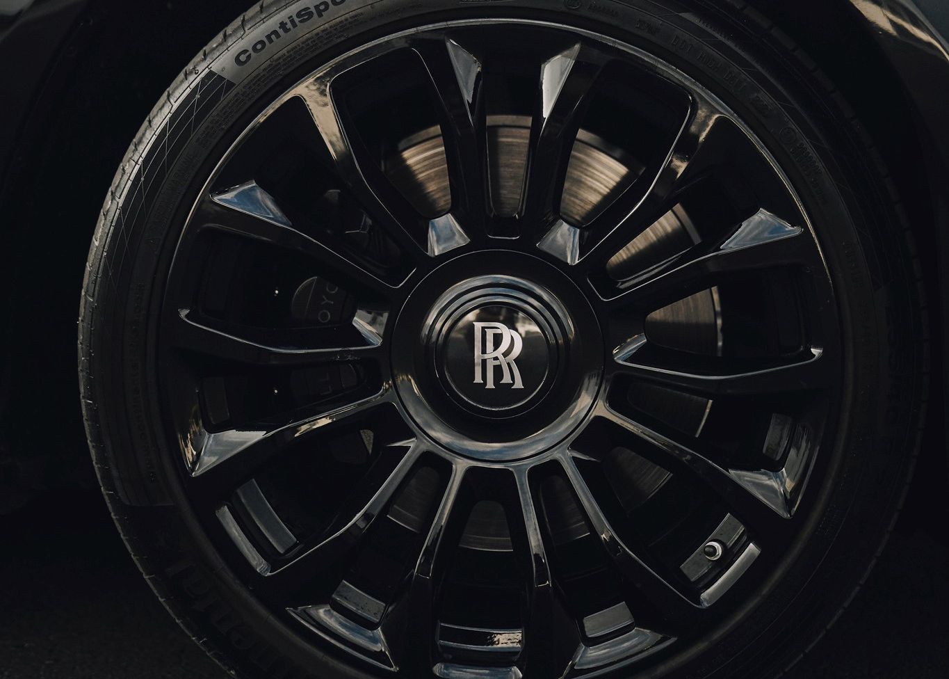 A close up of a Rolls Royce wheel.