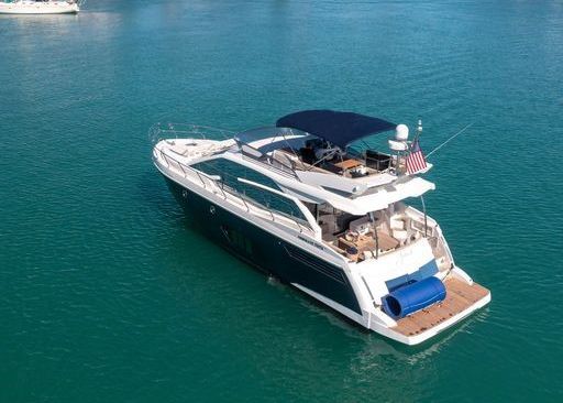 An aerial view of a yacht floating on top of a body of water.