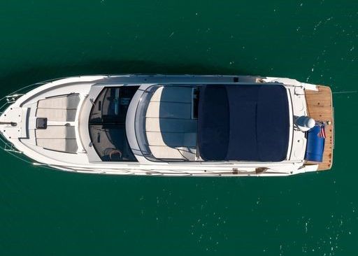 An aerial view of a boat floating on top of a body of water.