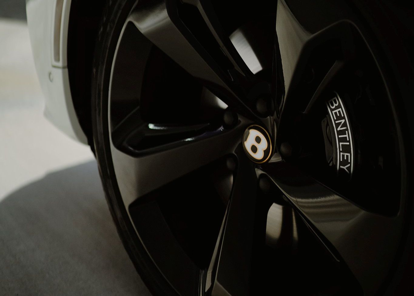 A close up of a Bentley car wheel.