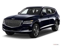 A blue Genesis G80 SUV is shown on a white background.