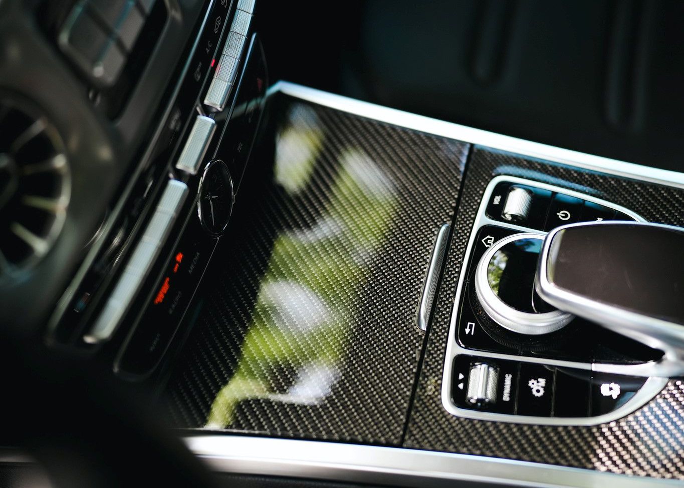 A close up of a car dashboard with a picture of flowers on it.