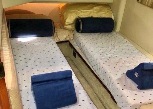 There are two beds in the cabin of a boat.