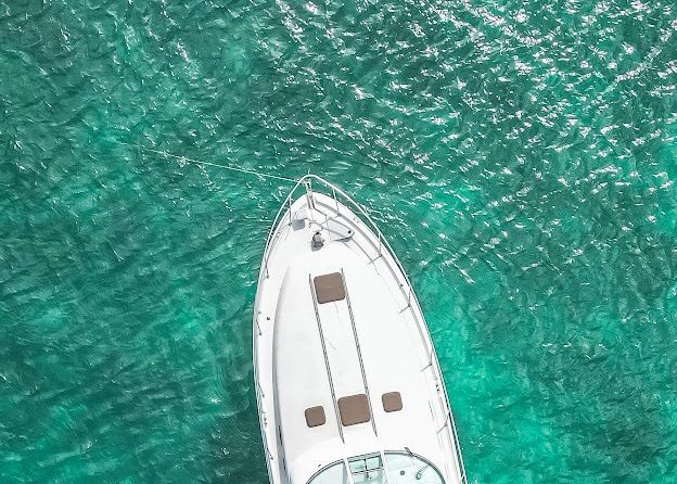 An aerial view of a boat in the ocean.