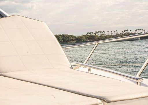 A boat is floating on top of a body of water.