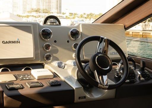 The steering wheel of a boat is made by garmin.