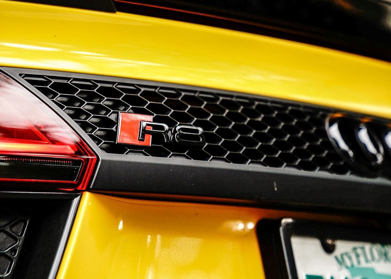 A close up of a yellow car with a license plate that says Virginia.