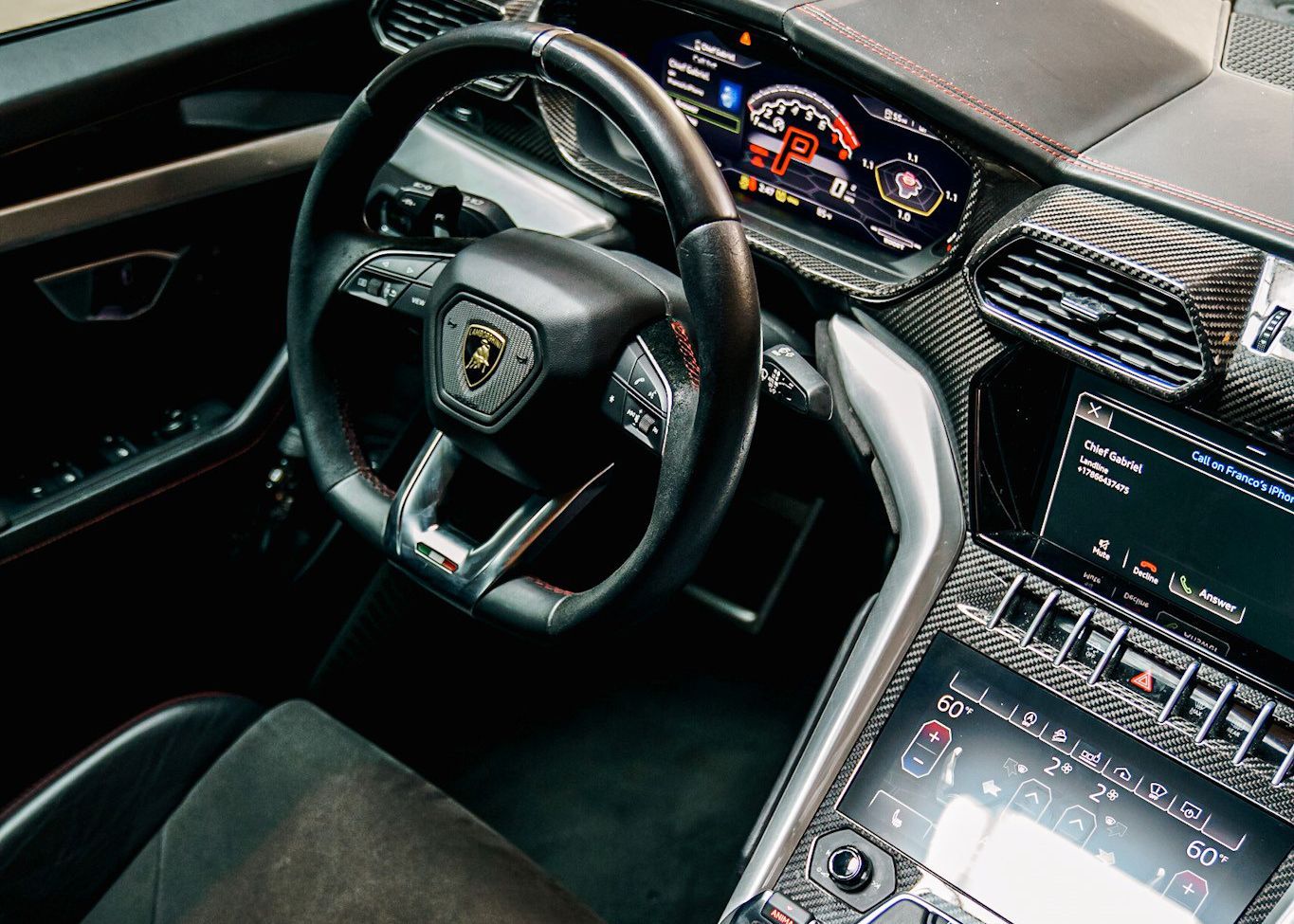 The interior of a car with a steering wheel and dashboard.