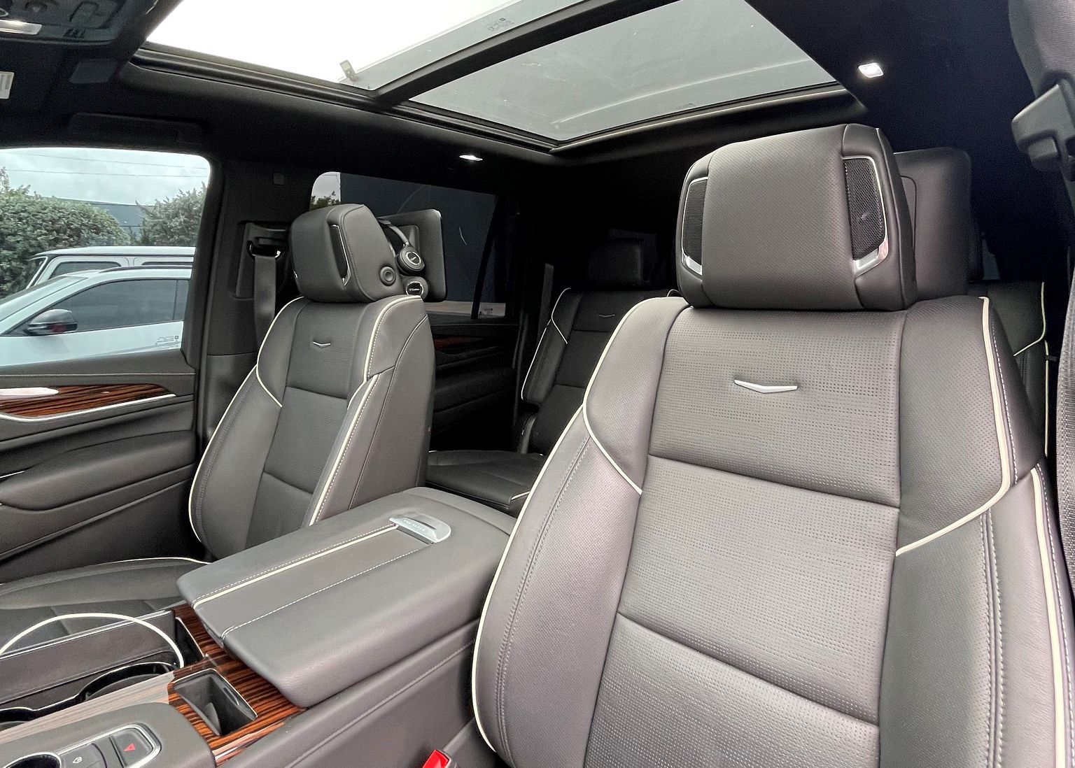 The interior of a Cadillac Escalade with a sunroof.