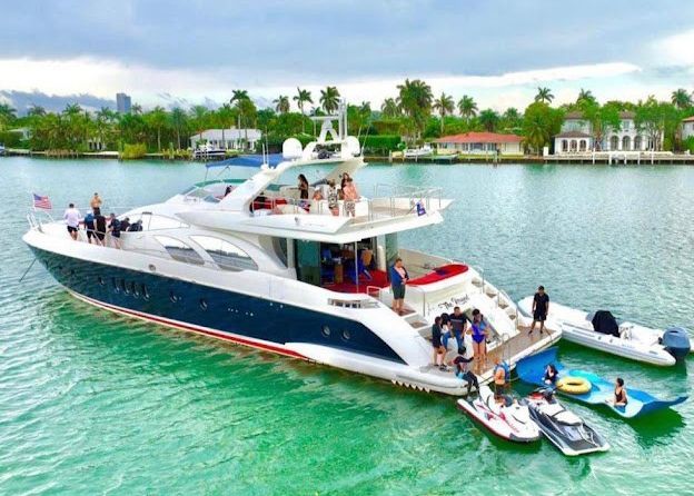 A large yacht is floating on top of a body of water.