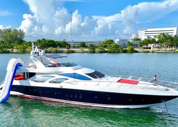 A large yacht is floating on top of a body of water.