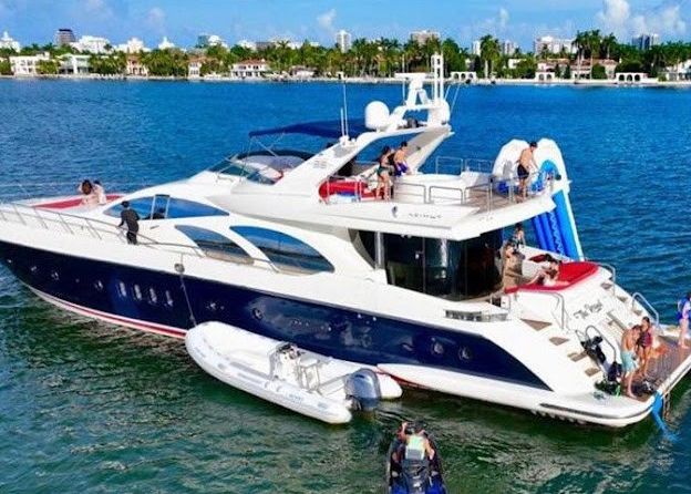 A large yacht is floating on top of a body of water.