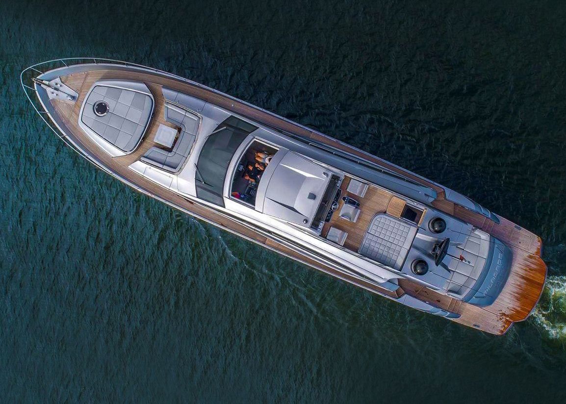 An aerial view of a boat floating on top of a body of water.