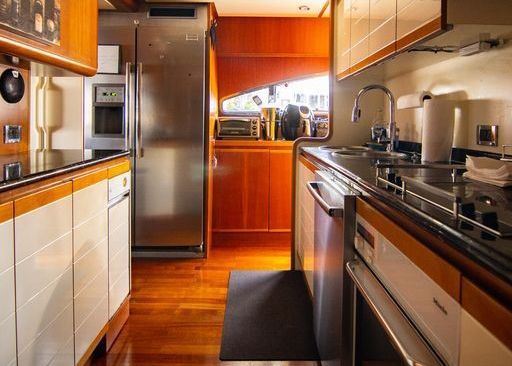 A kitchen with stainless steel appliances and wooden cabinets.