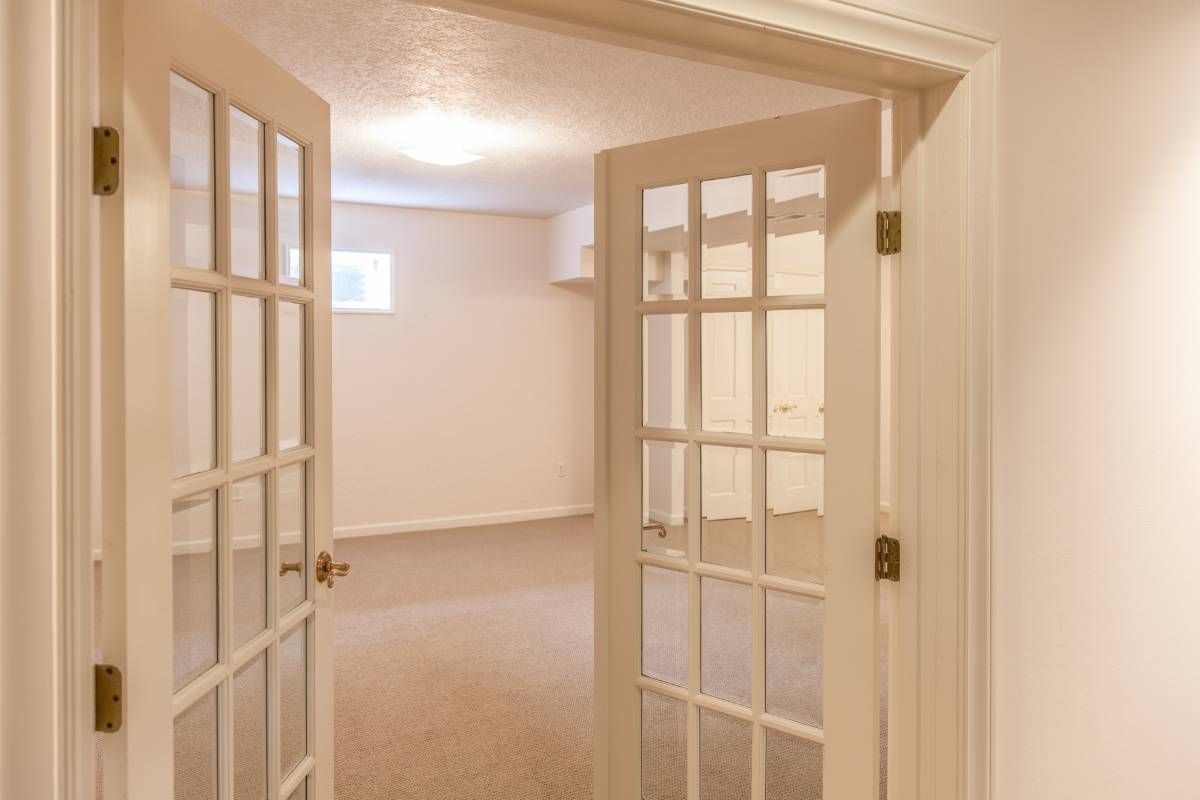 Two white French doors in an empty home near Toledo, OH