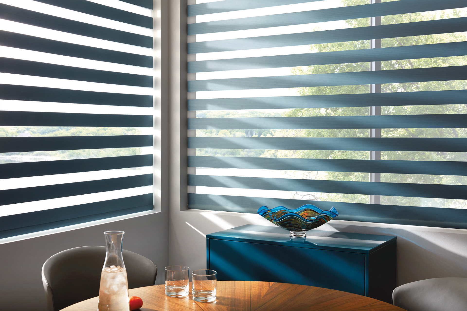 Hunter Douglas banded shades in a posh dining area