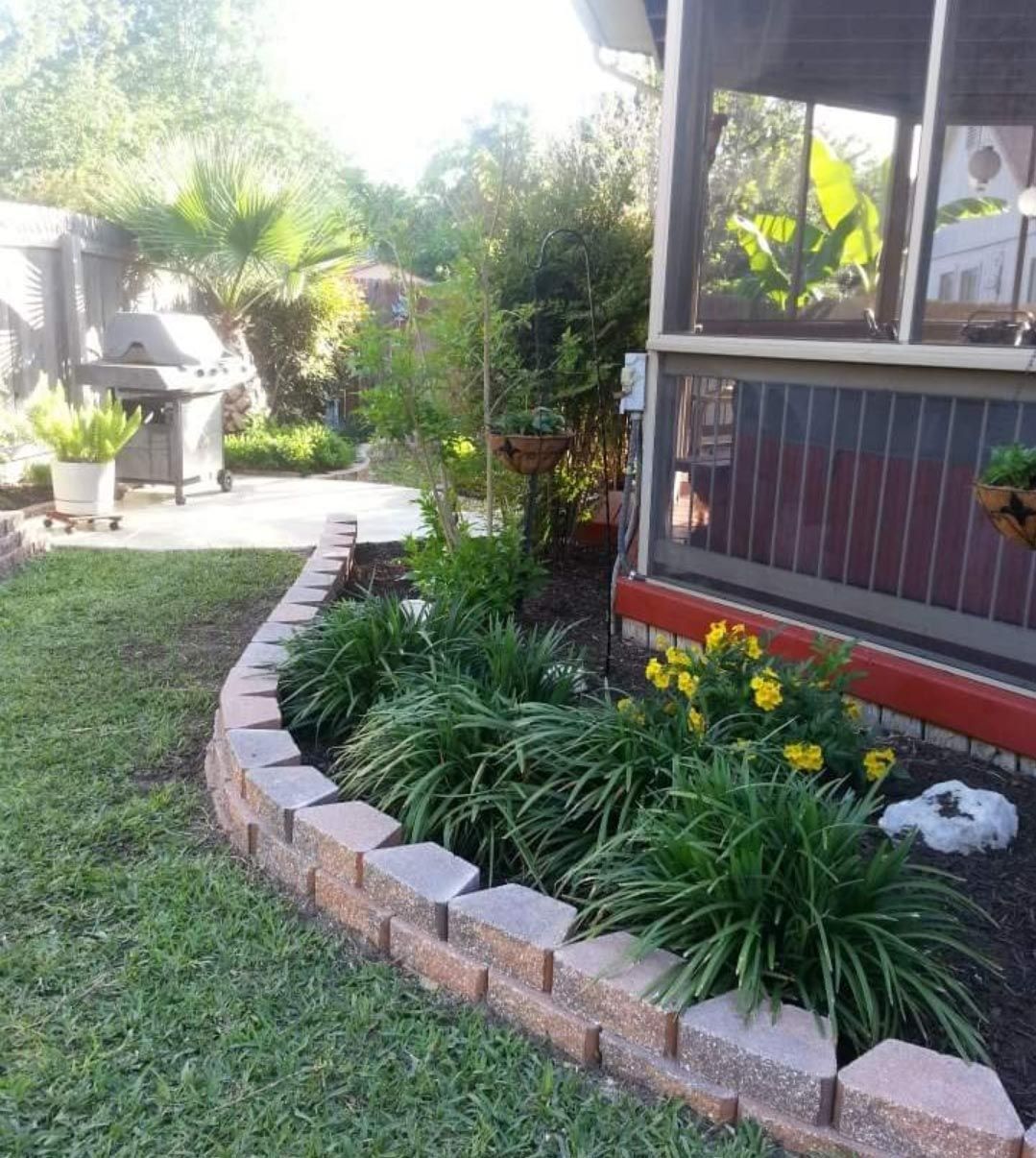 A backyard with a screened in porch and a grillDesign element