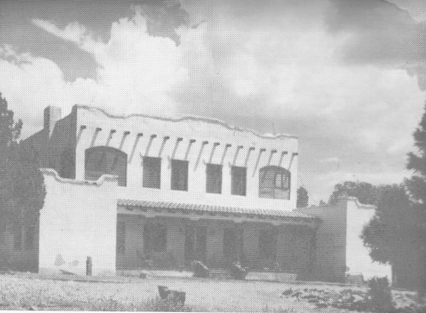 A black and white photo of a large white building