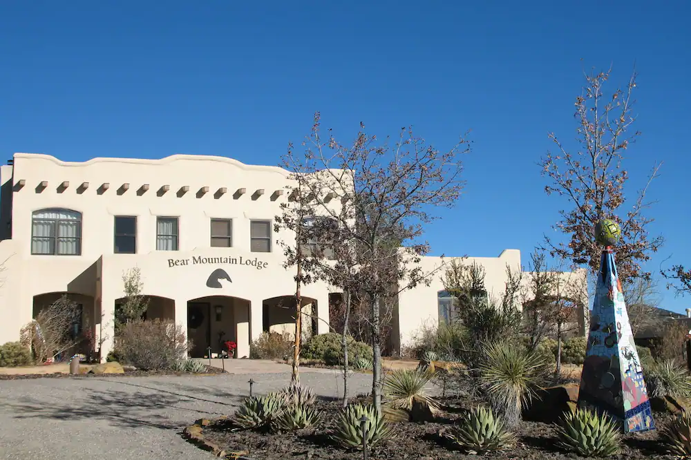 A large white building with a blue sky in the background