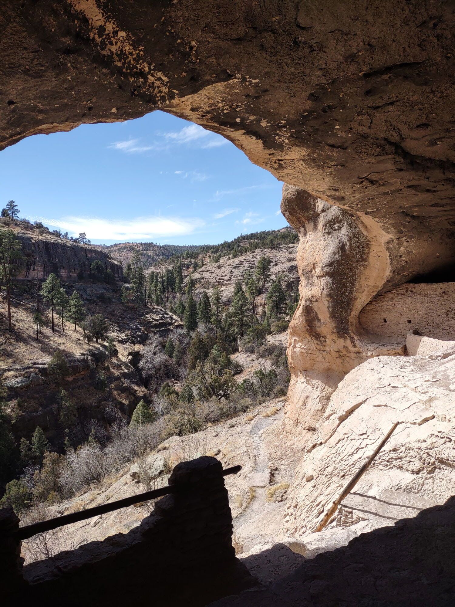 A view of a canyon from inside a cave.