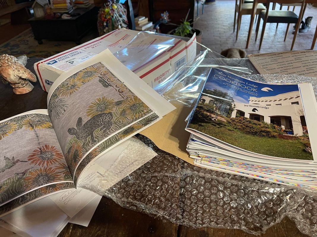 A quilt with leaves and a bird on it