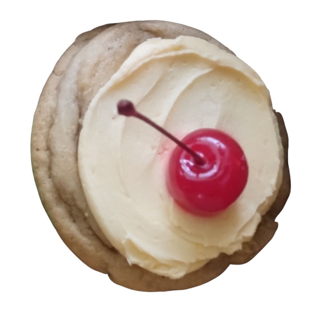 Frosted cookie topped with a cherry.