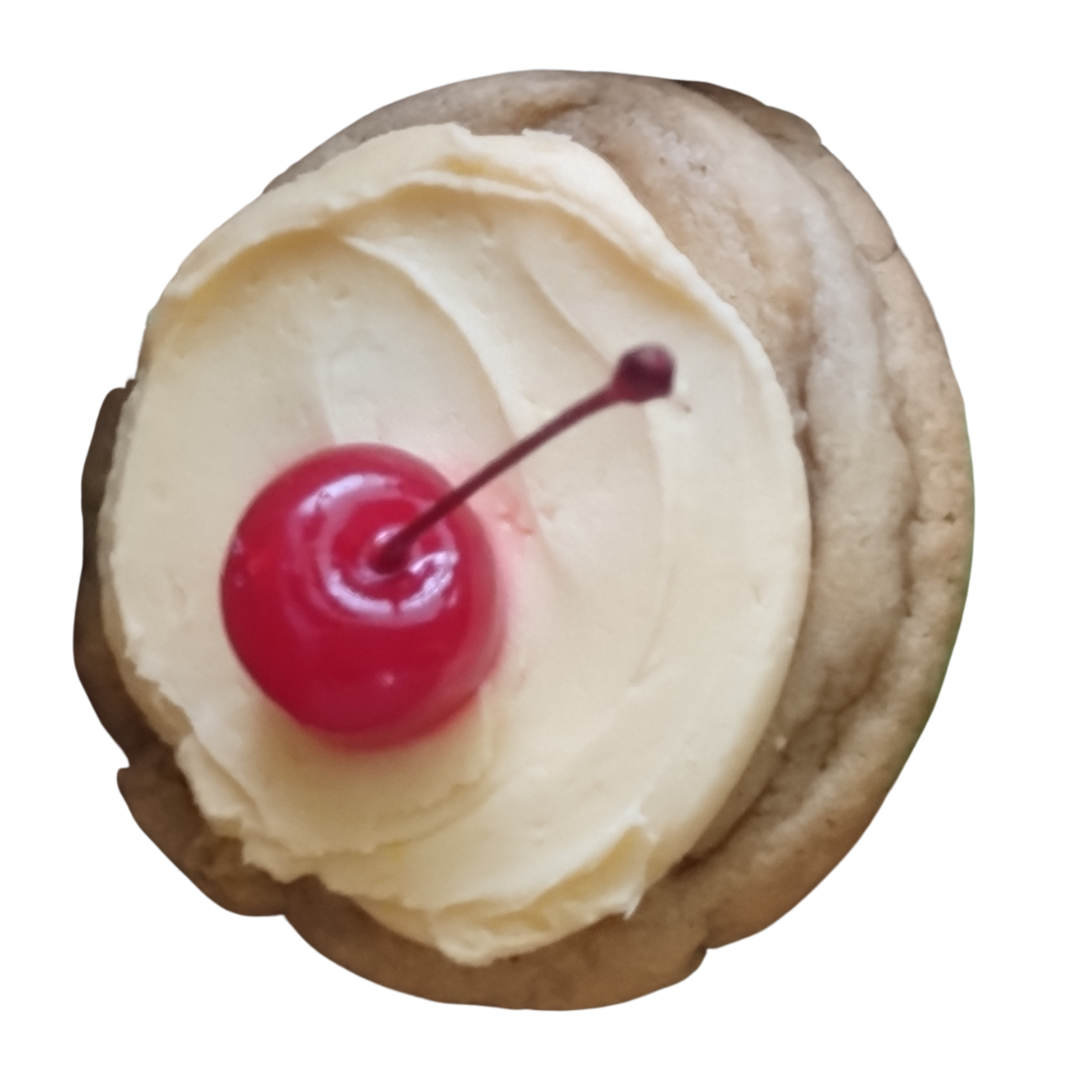 Cookie with white frosting and a cherry on top.