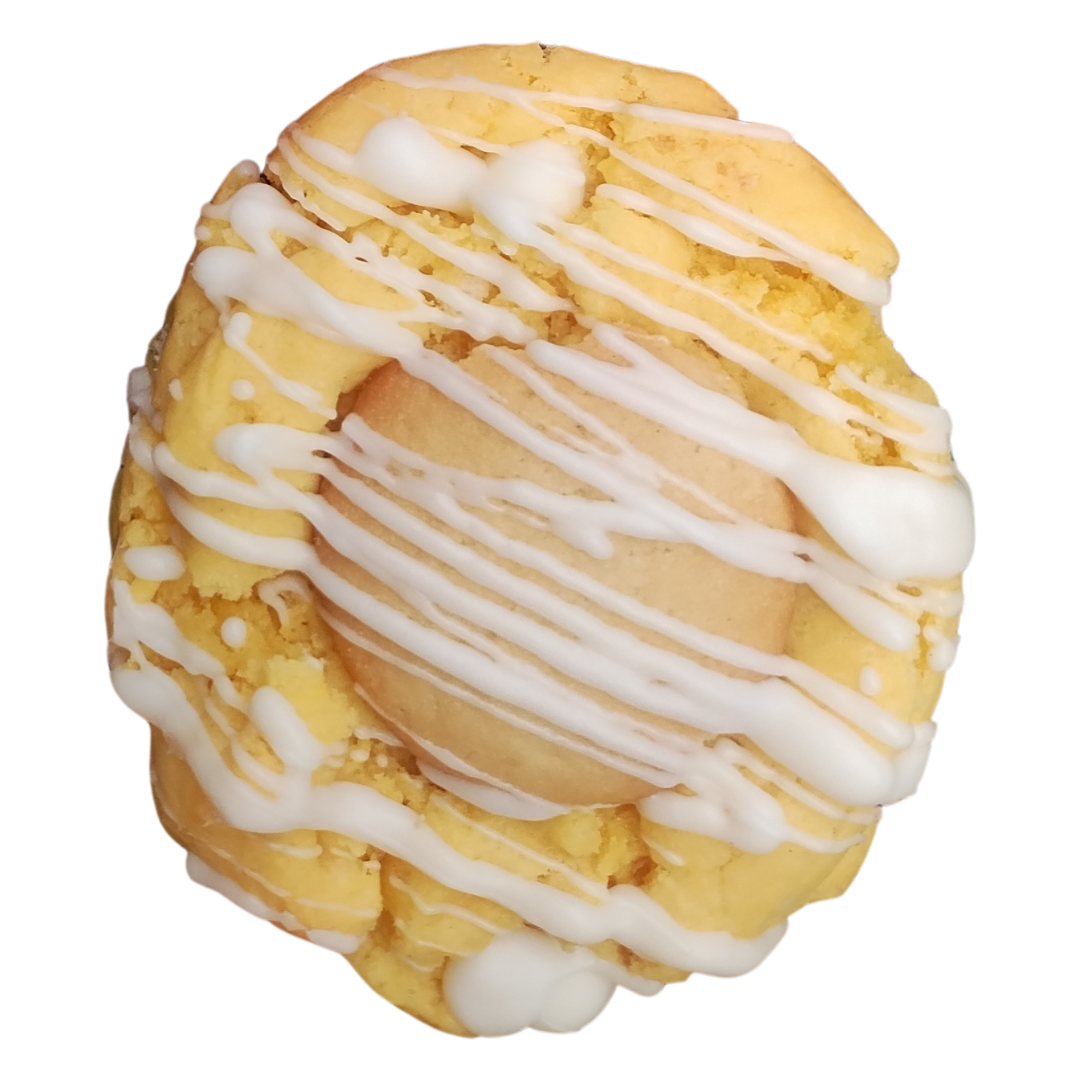 Cookie with white icing drizzle and a light-colored center.