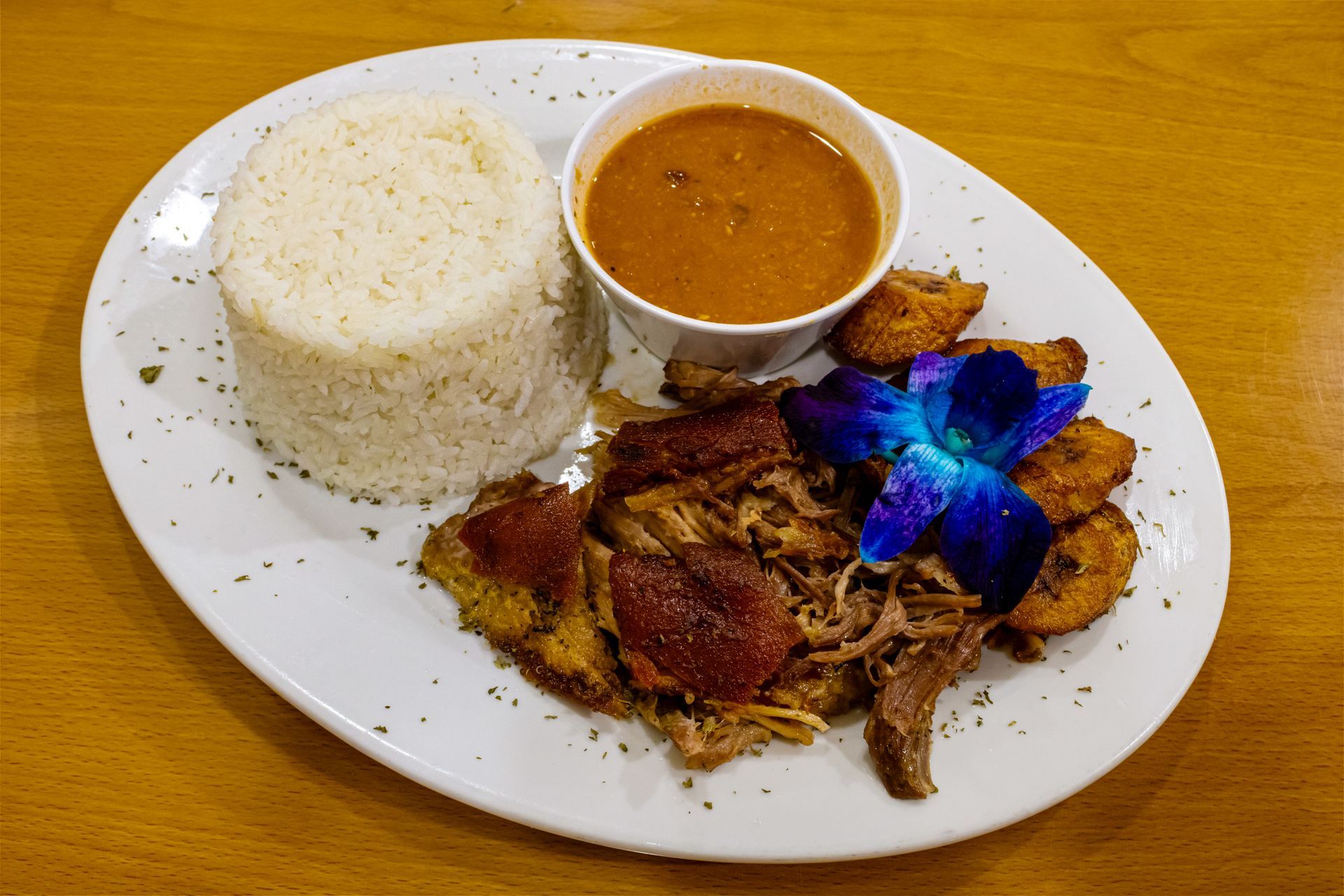 Slow-roasted pernil with rice and beans