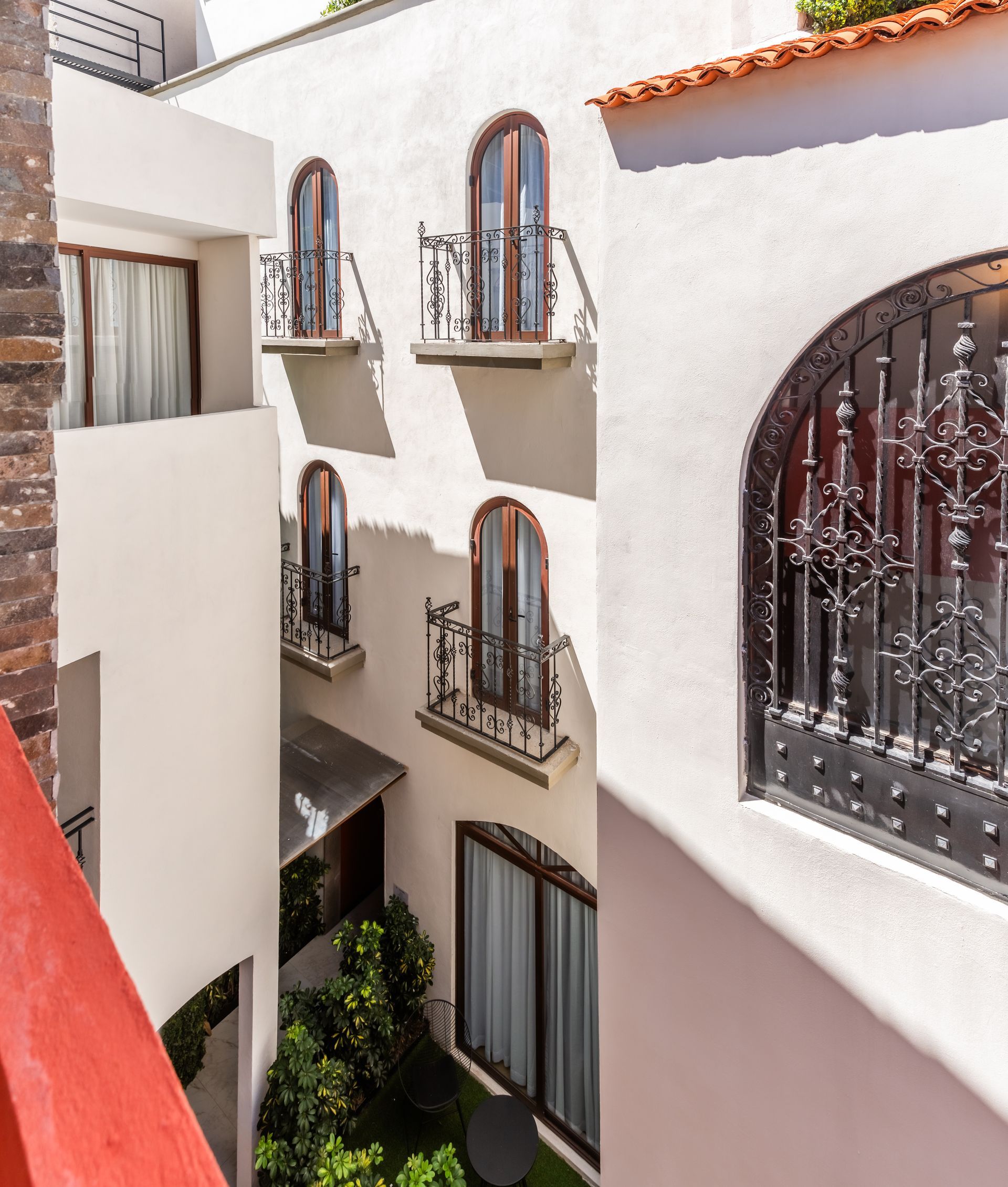 A white building with arched windows and balconies