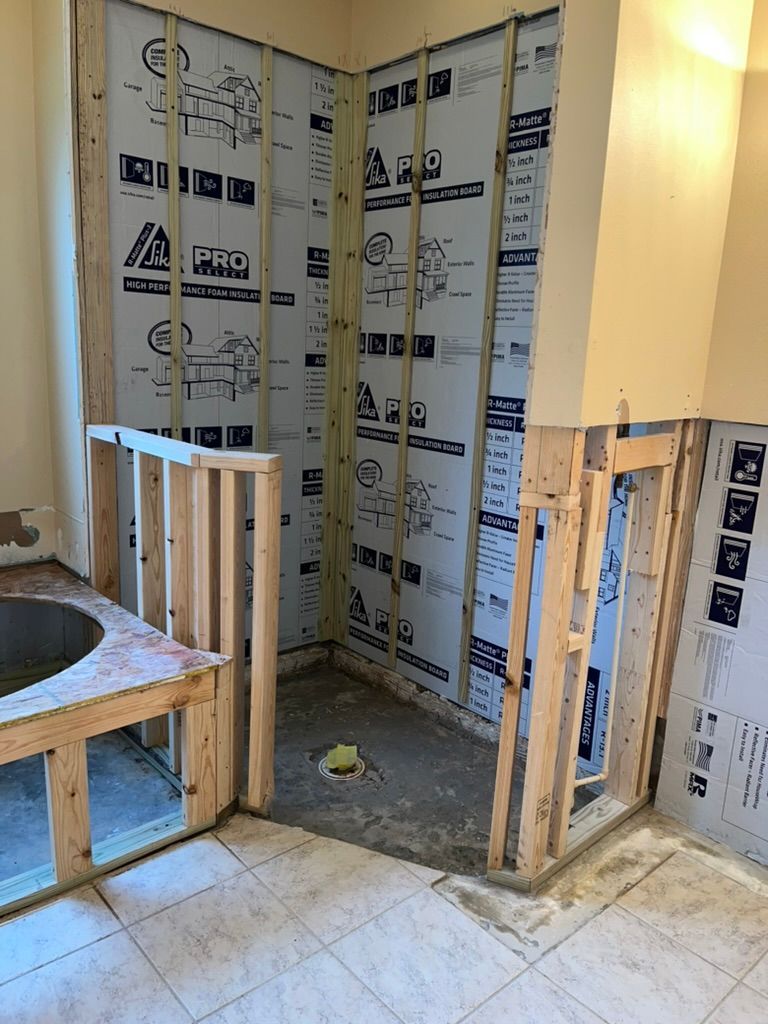 A bathroom under construction with a tub and shower — Ocala, FL — Puddles Restoration