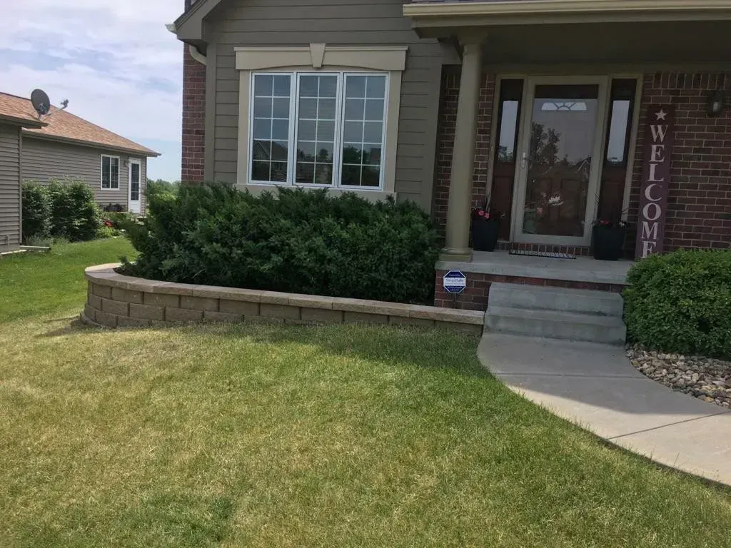 A house with a welcome sign in front of it.