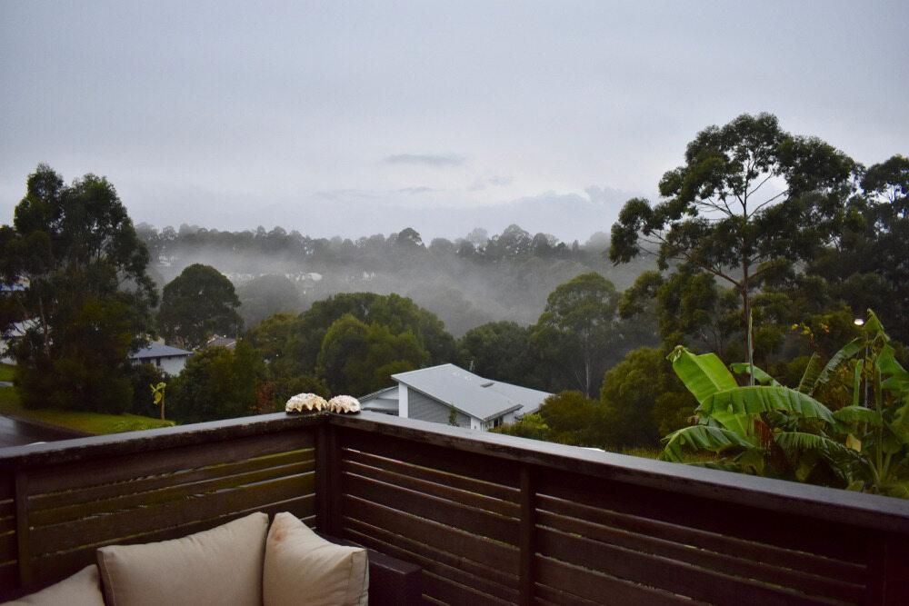 A Balcony With a View of Trees and Houses on a Cloudy Day — AJM's Air Conditioning Centre in Goonellabah, NSW