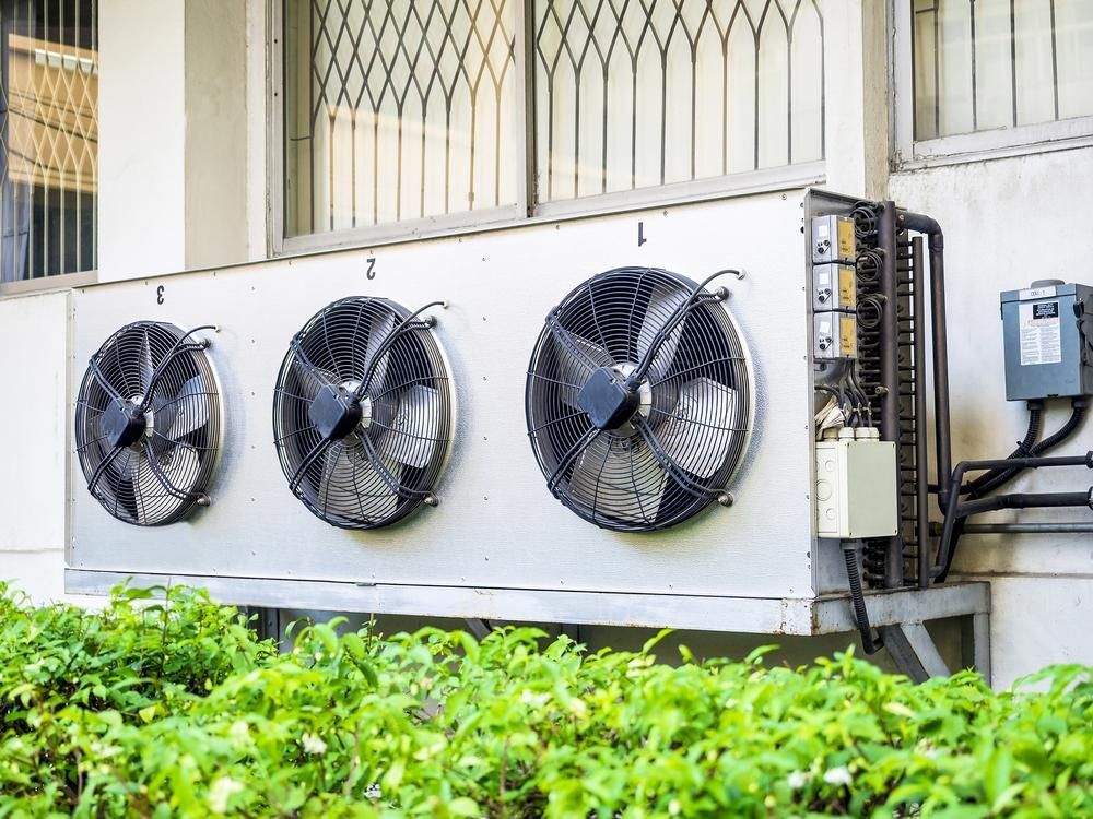 There Are Three Fans on the Side of a Building — AJM's Air Conditioning Centre in Lismore, NSW