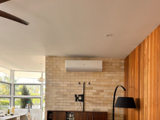 A tile wall with a hire unit and air con unit above — AJM's Air Conditioning Centre in Lismore, NSW