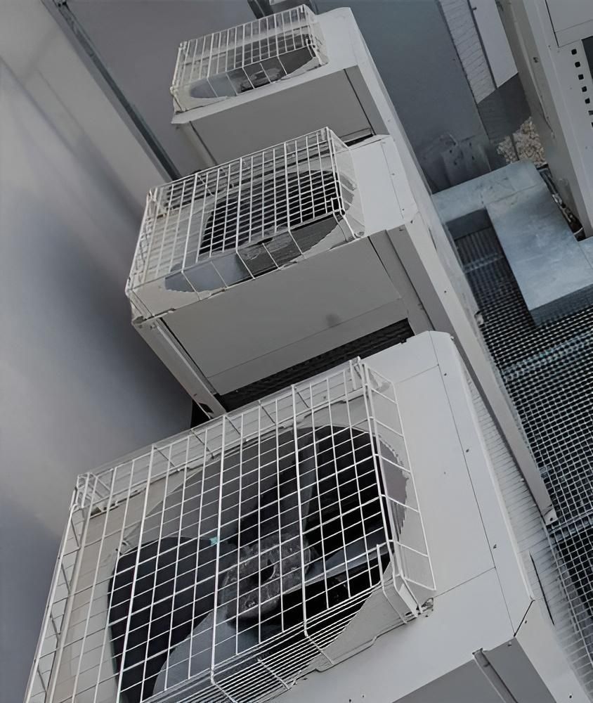 Three Air Conditioners Are Stacked on Top of Each Other on a Building — AJM's Air Conditioning Centre in Lismore, NSW