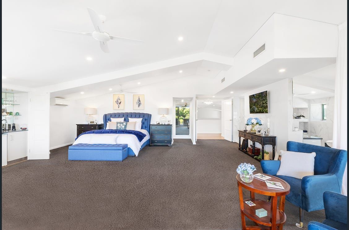 A room with a blue bed and chair to the right — AJM's Air Conditioning Centre in Lismore, NSW