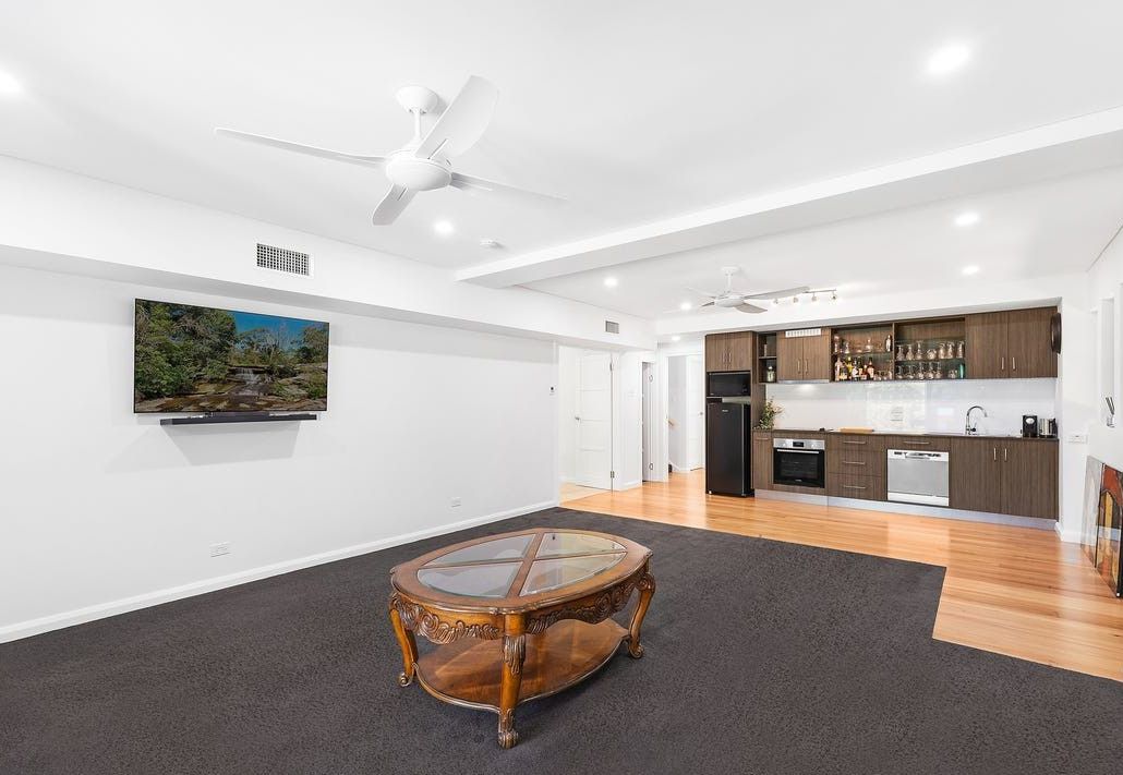 A living room with a hire unit and air con unit above — AJM's Air Conditioning Centre in Lismore, NSW