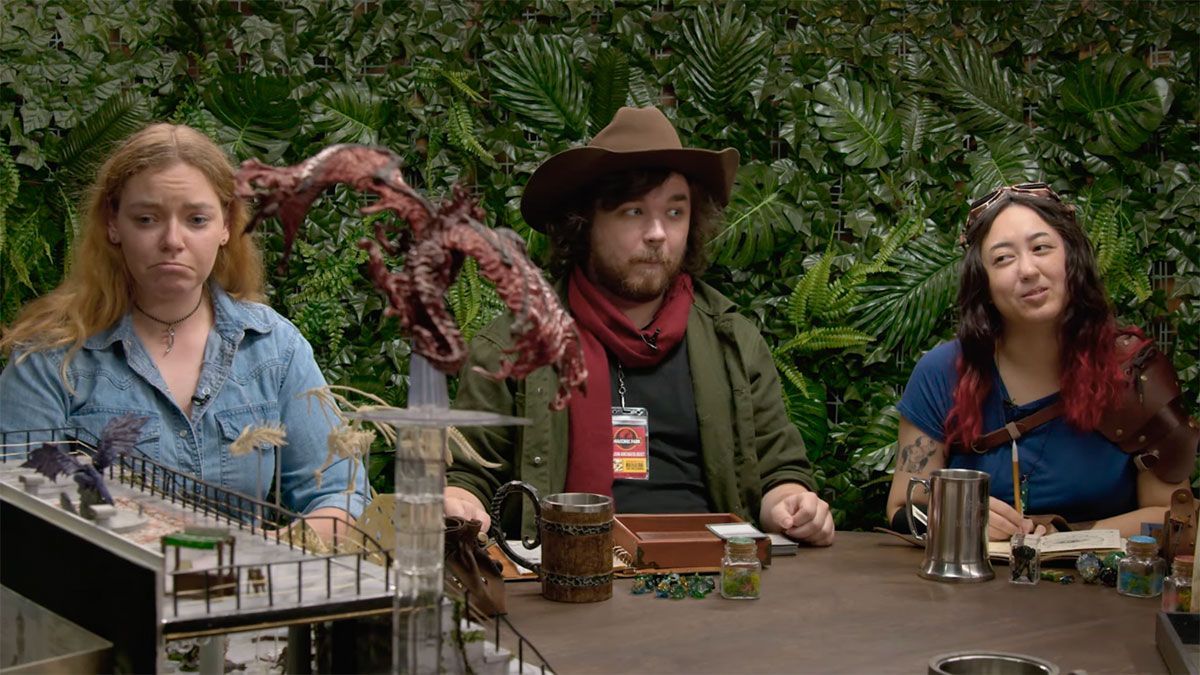 A group of people are sitting at a table with a dragon on it.