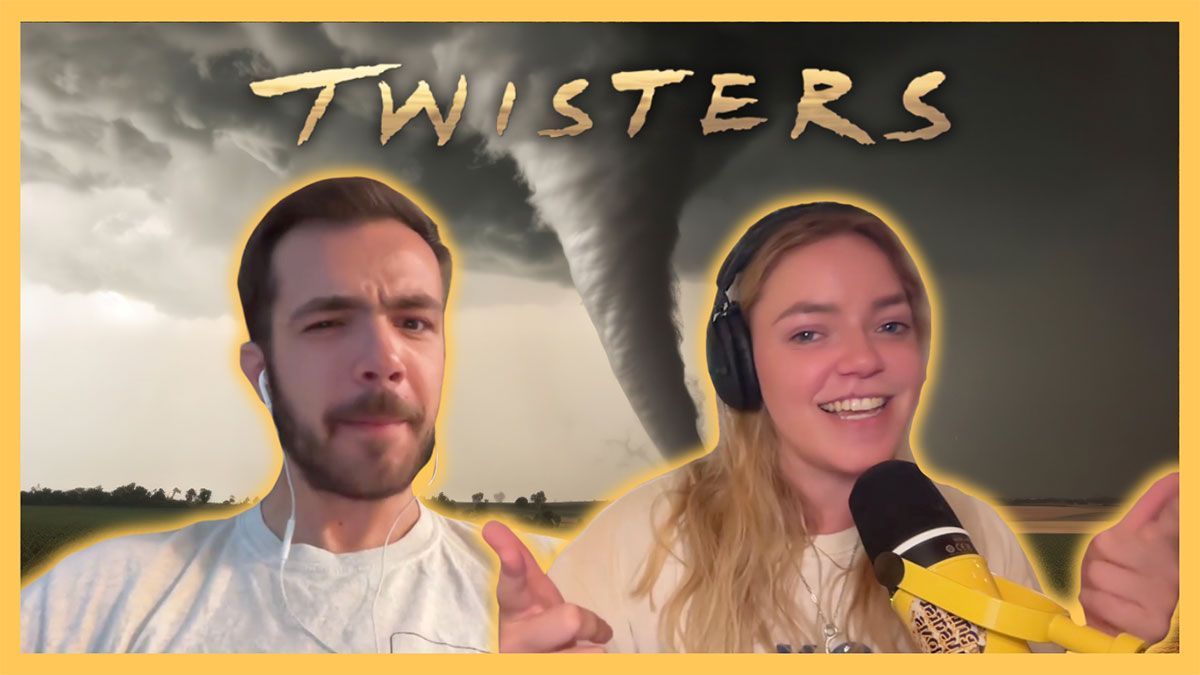 A man and a woman are talking into microphones in front of a tornado.