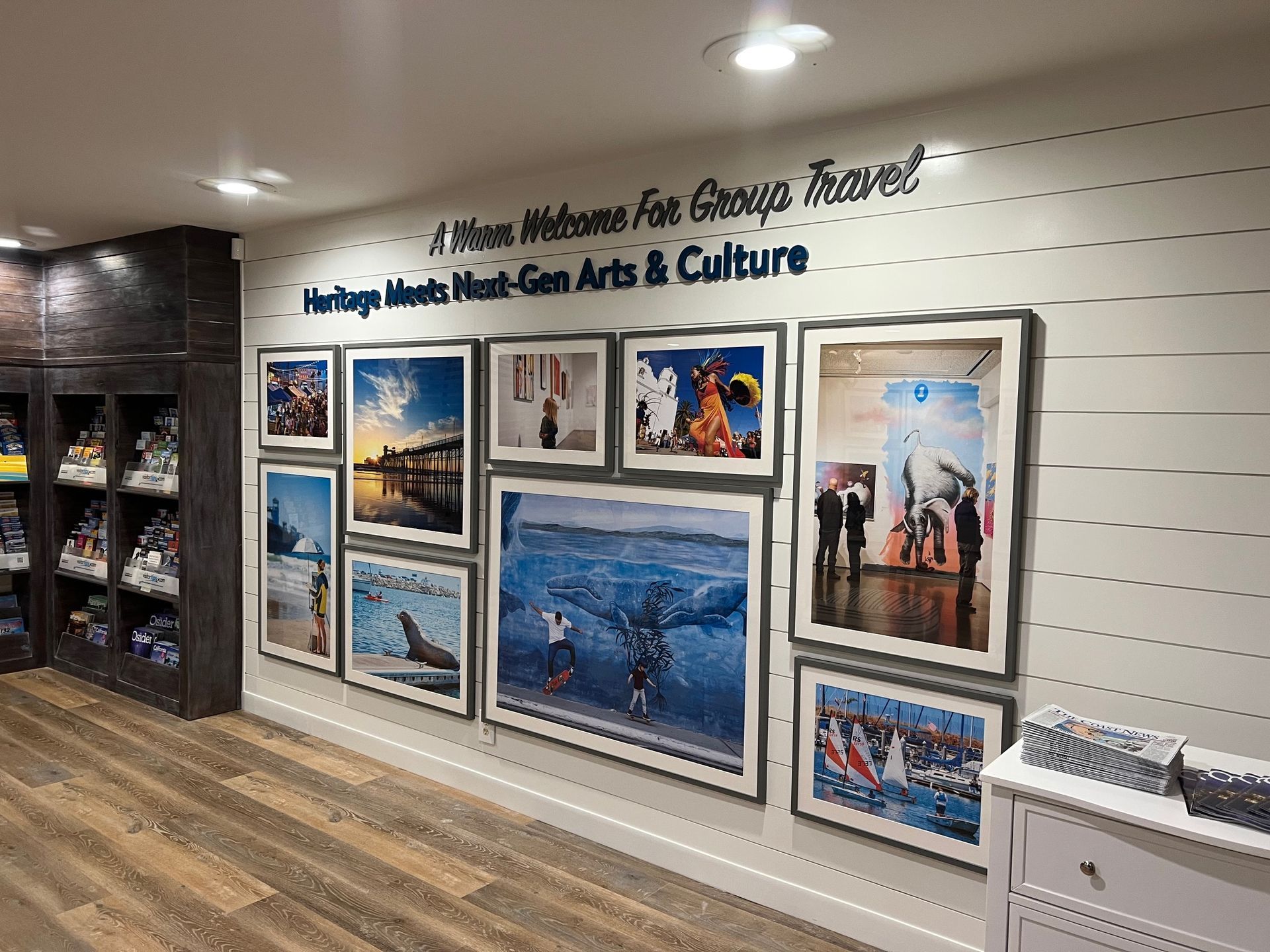 Hallway gallery wall with framed Hmong arts and culture photos and displays