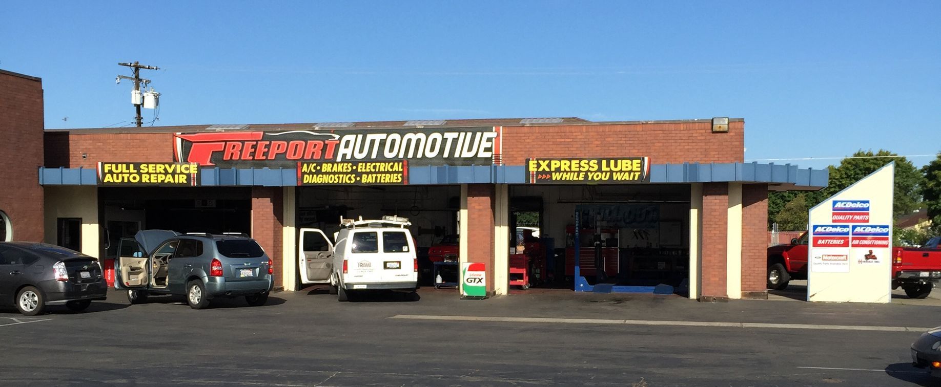 A brick building with the word automotive on it