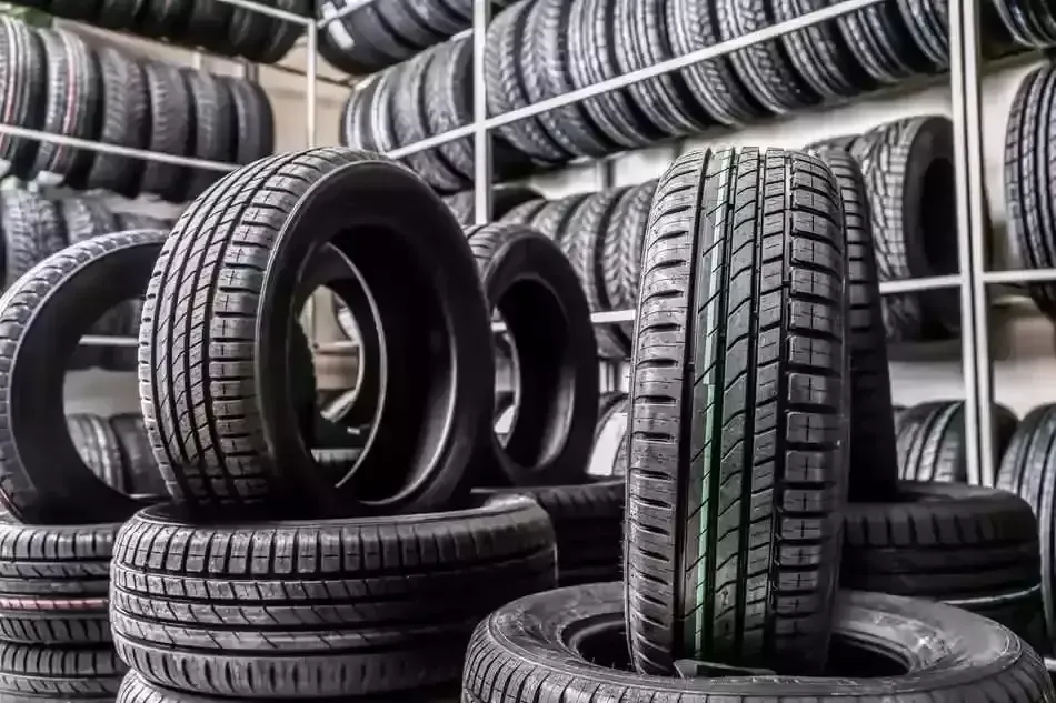 Various Tires on shelves and stacked | PRO-CAT Auto Care & Repair