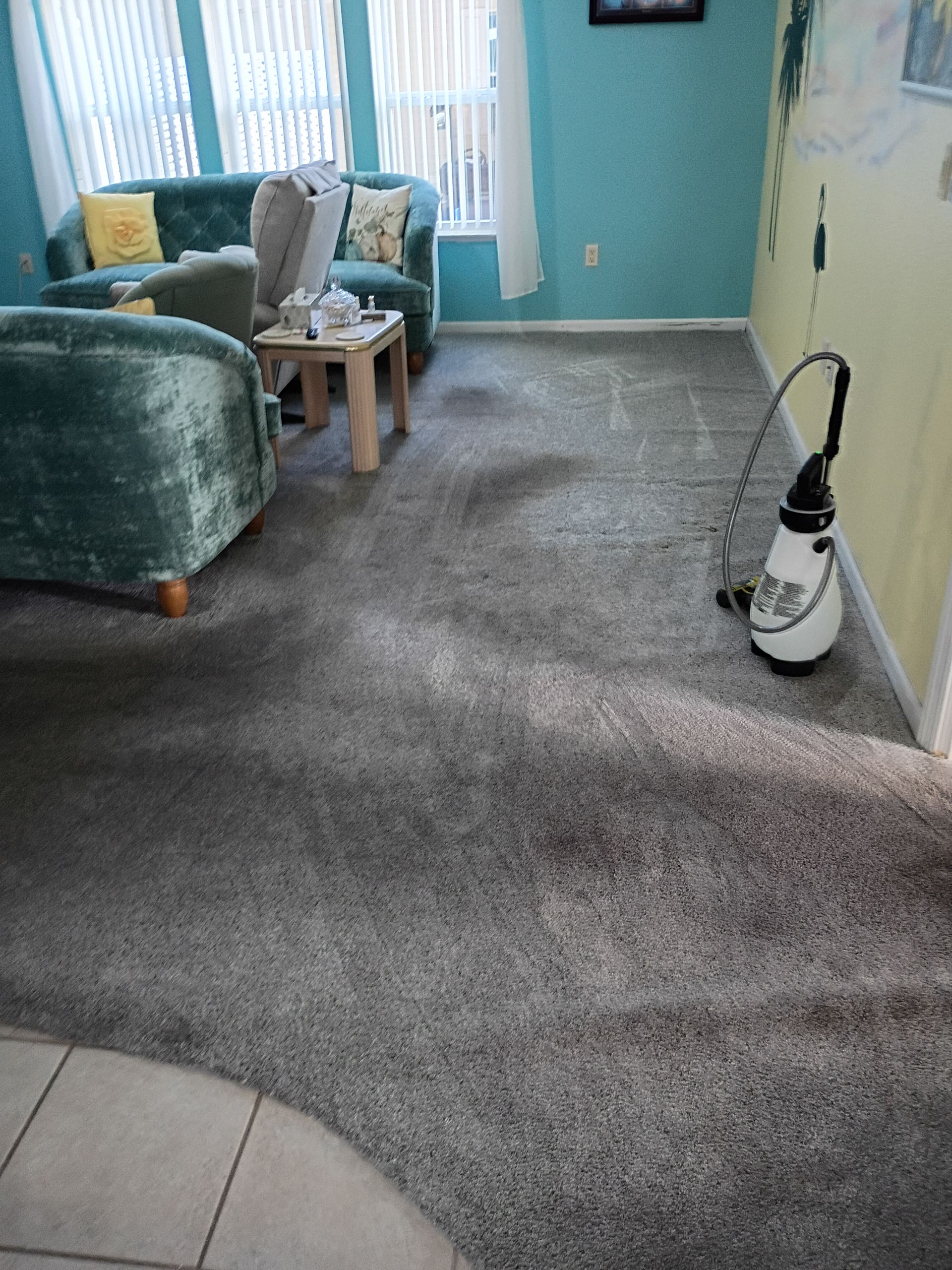 After - Cleaning a beige tile floor in a bathroom