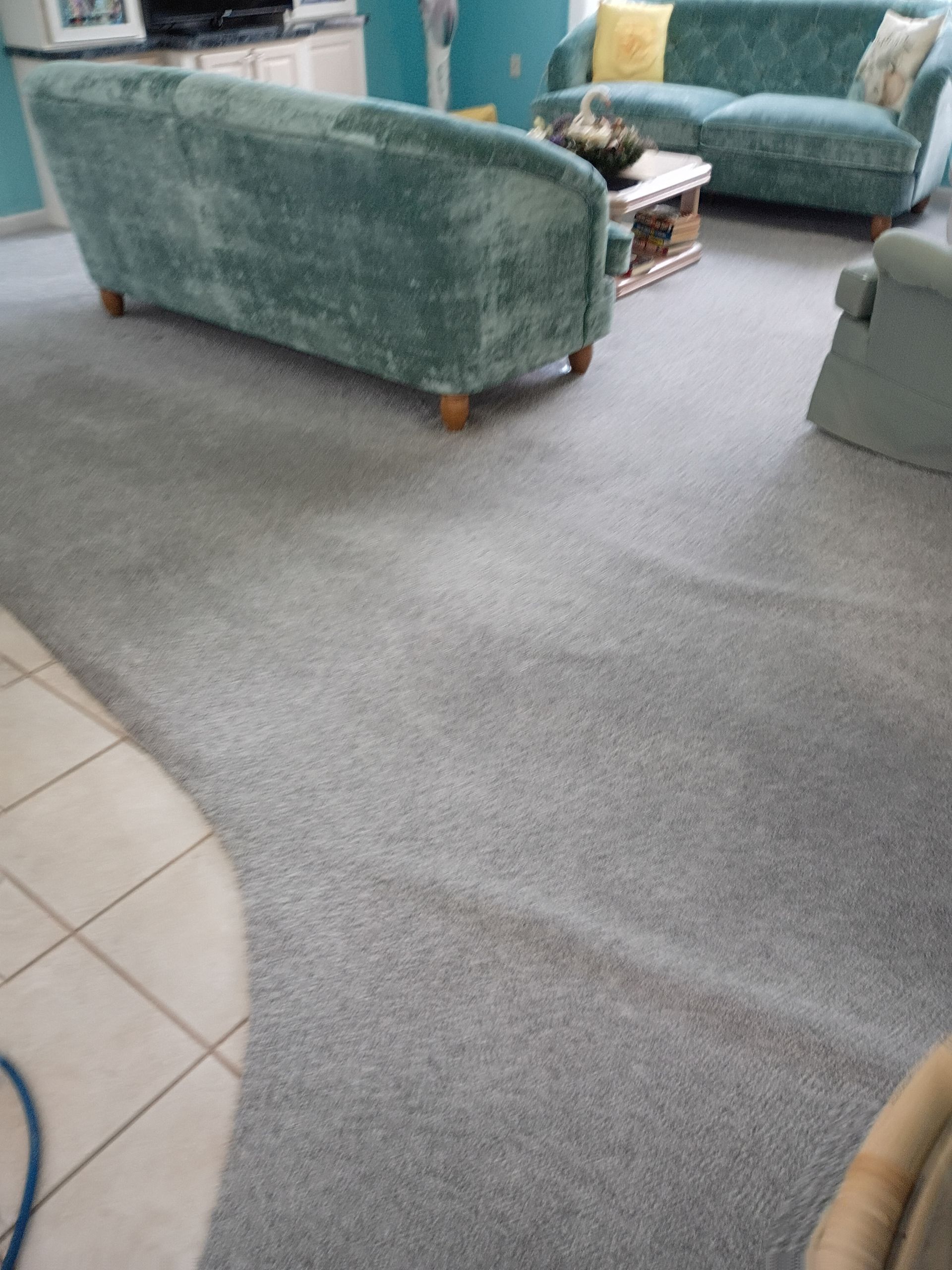 Before - Cleaning a beige tile floor in a bathroom