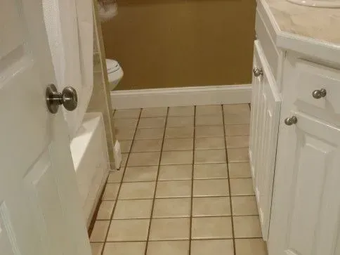 After - Cleaning bathroom floor with beige tiles